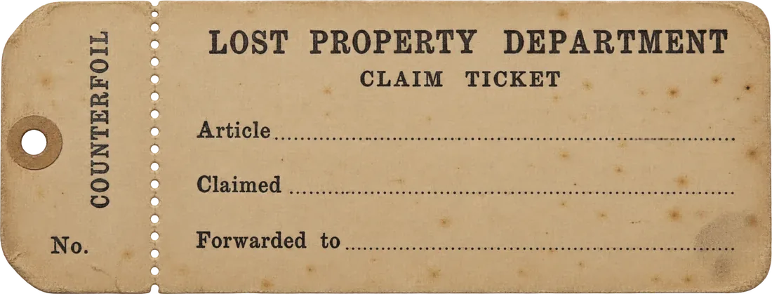 An old buff card claim ticket from the Lost Property Department, with a perforated counterfoil